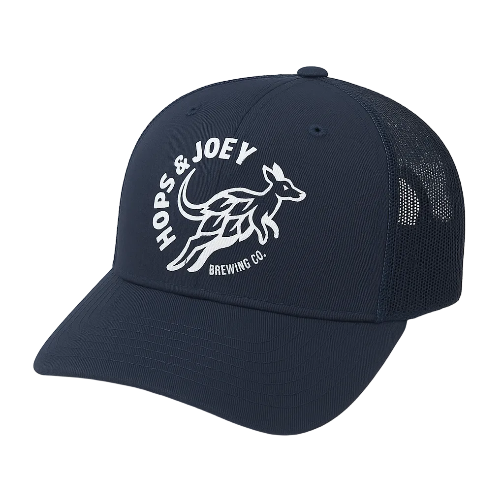 Navy blue cap with white logo on a light beige background